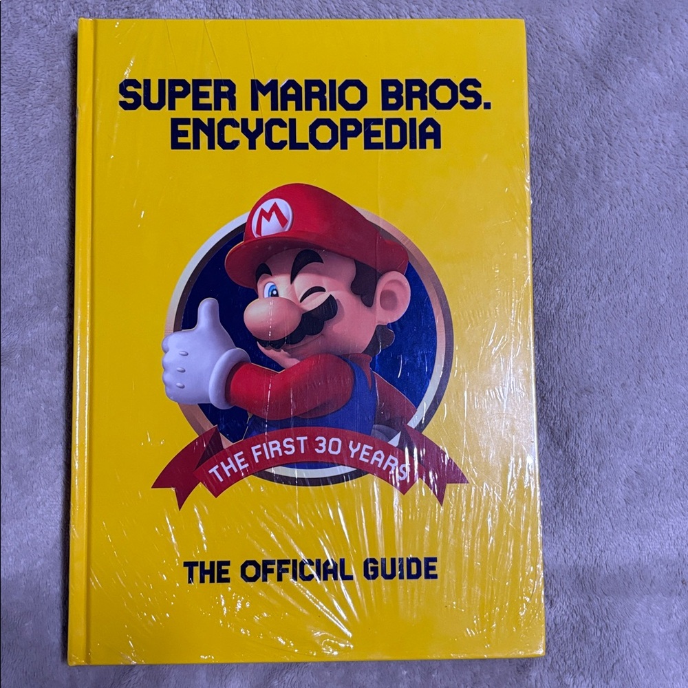 Super Mario Bros. Encyclopedia…NWT.. Sealed in plastic…